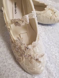 Ivory, or Off-white color lace over satin flat shoes. THESE SHOES DESIGNS ARE HAND DYED AND EMBELISHED TO ORDER THEREFORE, SHOES CAN NOT BE RETURNED OR EXCHANGED; PLEASE MEASURE YIUR FEET LENGHT TO CONFIRM YOUR SIZE FOR THESE PARTICULAR SHOES I'LL MAKE ALL THE EFFORTS TO HELP YOU HAVE A PLEASANT SHOPPING EXPERIENCE. ALTHOUGH THE PICTURES LOOK IVORY, IT IS ACTUALLY OFF-WHITE. HERE'S THE LINK FOR IVORY COLOR: YOU CAN CONTACT ME IF, YOU NEED TO PREVIEW COLOR, I CAN SEND A SWATCH SAMPLE https://www. Elegant Wedding Shoes With Lace Work, Lace Wedding Shoes With White Laces, Closed Toe, Lace Wedding Shoes With White Laces, Wedding Shoes With Lace Work, Closed Toe Lace Wedding Shoes With White Laces, Lace Wedding Shoes With Lace Work, Lace Wedding Shoes With Lace Trim And Round Toe, Lace Flat Heel Wedding Shoes For Ceremony, Cream Lace Pointed Toe Wedding Shoes