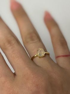 Beautiful blue needle double point ring set in gold-plated adjustable S925 ring.  A type of clear quartz with blue needle-like inclusions caused by trapped gasses during the formation of the stone. There are different reasons why the lines within the quartz give off a "blue hue" but the Tyndall Effect is known for scattering light particles in a colloid or in a very fine suspension. The color is blue light wavelength that is scattered much more strongly than red.  A calming stone which protects from negativity.  Also known as angel feathers.  Set in S925 adjustable ring band. All items in my shop are 100% from nature. They have not been heat-treated or aura colored. They have been mined, polished and set in to minimalistic jewelry settings. Minimalist Adjustable Faceted Rings, Adjustable Yellow Gold Moonstone Open Ring, Adjustable Gold Crystal Ring With Moonstone, Adjustable Oval Yellow Gold Crystal Ring, Adjustable Oval Gold Moonstone Ring, Adjustable Yellow Gold Oval Crystal Ring, Adjustable Gold Oval Moonstone Ring, Gold Teardrop Opal Ring Gift, Adjustable Oval Crystal Ring In Yellow Gold