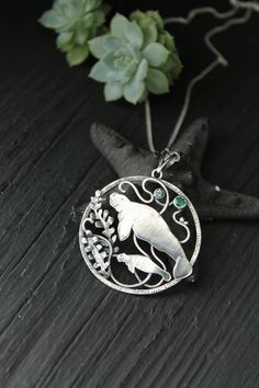 ITEM DESCRIPTION: The size of the pendant - H 4 х W 4 cm (1 1/2 x 1 1/2 inches), weight 8g. Jewelry will come to you in a gift box - ready for gifting. I made this motherhood jewelry of sterling silver, hydrothermal emerald, and topaz London. This unique necklace looks so touching. This is a story of the relationship between parents and children. It is not easy. But this is important for each of us. I hope this wire wrapped necklace will be a wonderful gift for someone whole you love: for your m Sterling Silver Locket Jewelry As Gift For Mom, Hallmarked Medallion Jewelry For Gifts, Pendant Locket Jewelry Gift For Mom, Pendant Locket Jewelry As Gift For Mom, Symbolic Gift Jewelry With Birthstone, Spiritual Pendant Jewelry For Mother's Day, Symbolic Birthstone Jewelry For Gift, Personalized Amulet Style Pendant Jewelry, Personalized Amulet Pendant Jewelry