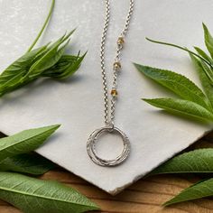 This elegant necklace offers up a unique combination of playfulness & timeless style. Three organically shaped & uniquely textured sterling silver circles layer gracefully on a lovely sterling silver double cable chain. Each ring is handcrafted individually to represent your journey through the decades. Circles are hammered flat & strong, and given a rustic sparkly texture. Three gemstones are intricately wrapped on the chain, creating a lovely birthstone accent. Choose from 15 gemstones! (Gems Sterling Silver Full Circle Necklace For Anniversary, Adjustable Silver Birthstone Necklace For Anniversary, Adjustable Nickel-free Birthstone Necklace For Anniversary, Nickel-free Adjustable Full Circle Jewelry, Adjustable Hypoallergenic Sterling Silver Necklace, Adjustable Sterling Silver Birthstone Necklace For Anniversary, Adjustable Silver Birthstone Necklace, Adjustable Sterling Silver Necklace - Gift For Her, Handmade Sterling Silver Full Circle Necklace