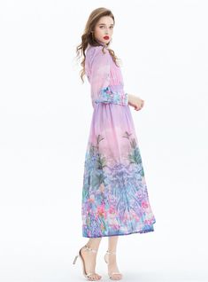 Oasis-like in its serene palette, this dress is a breath of fresh air with its fluid, pastel tones and delicate floral imagery. A vision of springtime charm, the high collar and long sleeves offer a dignified silhouette, while the gentle gathering at the waist cascades into a flowy skirt that dances around the calves. Each brushstroke of the print evokes a dreamy garden, with flowers in bloom and exotic birds in mid-flight, transforming the fabric into a wearable piece of art. Fastened with a neat row of buttons along the bodice and wrists, this dress marries simplicity with sophistication. Ideal for daytime events or enchanting evenings, it's a statement garment that doesn't shout but rather, whispers elegance. Fabric name: chiffonPattern: printingSleeve length: long sleevesMain fabric co Pink Casual Chiffon Dress For Spring, Casual Pink Chiffon Dress For Spring, Pink Bohemian Chiffon Dress For Spring, Bohemian Pink Chiffon Dress For Spring, Spring Bohemian Pink Chiffon Dress, Spring Chiffon Feminine Maxi Dress, Elegant Pink Chiffon Dress For Spring, Feminine Chiffon Maxi Dress For Spring, Feminine Maxi Length Chiffon Dress For Spring