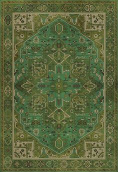 a green rug with an intricate design on the center and sides, in different colors