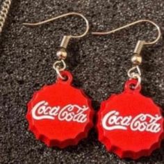 Brand New! Boutique Item! Charming Mini Coca Cola Bottle Cap Round Dangle Earrings! Cute & Small Dangle Earrings Made To Look Like Bottle Caps Of The Soda "Coke". See Pictures For Details. Comfortable & Easy To Wear. I Think We All Know Someone Who Is A Soda Addict - This Is The Perfect Gift For The Coke Brand Snob In Your Life!! Or Give To The Pepsi Lover In Your Family And Watch The Eyes Rollllllll!! Great Gag Gift! -Brand New, Never Worn -Great Gift / Present - Bundle Items In My Closet. The Fun Red Round Jewelry, Casual Red Earrings For Party, Casual Red Party Earrings, Nickel-free Casual Party Earrings, Casual Nickel-free Earrings For Party, Casual Red Nickel-free Earrings, Fun Red Adjustable Earrings, Casual Red Metal Jewelry, Small Dangle Earrings