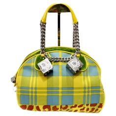 Introducing the Christian Dior Fall 2004 Gambler Dice Bowler Bag, a stunning creation by John Galliano for Christian Dior that exudes luxury and statement style. Crafted with meticulous attention to detail, this bowler-style top handle bag is a true masterpiece. The bag features a captivating contrast of yellow and blue plaid with hints of red leopard print and lush green velvet, creating a striking visual impact. The combination of textures and patterns adds depth and dimension to the design, s Custom Designer Bags, John Galliano Dior Bag, Botas Louis Vuitton, Cool Purses, Vintage Thrift Stores, Bowler Bag, Gucci Dress, Dior Logo, Christian Audigier