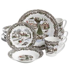 a set of christmas dinner plates and cups