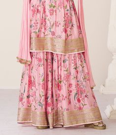 COLOR : Pink FABRIC : Top - Premium Organza Silk, Bottom - Premium Organza Silk, Inner - Santoon, Dupatta - Nazneen WORK : Zari Embroidery, Digital Print, Stones, Sequins, Lace Border OCCASION : Wedding, Reception, Engagement, Party Wear, Festival READY-TO-WEAR : No STITCHING : Available as semi-stitched fabric, can be stitched using standard size option (+$20). Note: There might be a slight color variation due to lighting and flash used during photoshoot. The bright shade seen is the best close Floral Print Traditional Wear For Eid Reception, Traditional Floral Print Sharara For Reception, Traditional Sharara With Floral Print For Receptions, Floral Embroidered Traditional Drape Sets For Navratri, Navratri Sets With Floral Embroidery And Traditional Drape, Traditional Drape Sets With Floral Embroidery For Navratri, Pink Floral Print Palazzo Set For Wedding, Festive Floral Print Palazzo Set For Reception, Pink Embroidered Palazzo Set For Reception