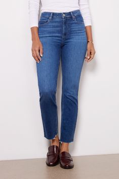 With a classic straight leg and versatile blue wash, you'll be wearing these Paige jeans on repeat. The Cindy is crafted in soft stretch denim and features a flattering high rise and raw cut hems. Dark Wash Straight Leg Jeans With Frayed Hem, Everyday Cropped Jeans With Frayed Hem, Everyday Jeans With Frayed Straight Hem, Everyday Jeans With Frayed Hem, Classic High Rise Jeans With Frayed Hem, Mom Fit Denim Cropped Jeans With Frayed Hem, Straight Bottoms With Frayed Hem In Medium Wash, Medium Wash Straight Bottoms With Frayed Hem, Classic Cropped Jeans With Frayed Hem