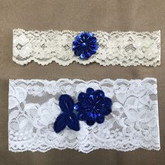 Handmade Garters.  Beautiful Ivory or white stretch lace, accented with hand sewn Royal Blue sequin appliqué. The 3" wide garter has Double-Sided Tape, to make sure it doesn't slid down on your big day.  Before using the tape, please kindly keep the skin clean & dry. Make sure the skin is free from lotions, oils & powder. The smaller garter is 1.5" wide, larger garter is 3" wide. The set includes one of each. Please measure your thigh wherever you plan to wear the garters (usually 4 inches above the knee). Use a flexible measuring tape, wrap it around your thigh and note where it overlaps. OR You may use a piece of string, mark the spot where it overlaps, then compare it to a ruler or measuring tape. Please give us the EXACT measurement, as we will take out the appropriate amount of lace t Blue Lace Wedding Sets, Royal Blue Garter, Bridal Garter Blue, Crystal Garter, White Lace Garter, Wedding Garter Blue, Bridal Garter Lace, Lace Garter Set, Wedding Garter Lace