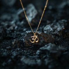 Connect with the sacred sound of the universe with our gold Om pendant, finely crafted in the USA. Representing the essence of ultimate reality, consciousness, and inner peace, each piece is a harmonious blend of spirituality and artistry. PENDANT INFORMATIONThis pendant is made of real, solid gold.• Made in USA• Size: Mini• Material: 14k or 18k solid gold• Finish: polished• Height: 0.9" (22,5 mm) | *includes the small circle, bail dimensions not included• Width: 0.85" (22 mm)• Pendant weight (a Spiritual Rose Gold Jewelry For Meditation, Spiritual Rose Gold Pendant Necklaces, White Gold Spiritual Necklace With Gemstone, Spiritual White Gold Gemstone Necklace, Spiritual 14k Gold Round Pendant Jewelry, Spiritual 14k Gold Round Pendant, 14k Gold Spiritual Round Pendant Jewelry, Spiritual Sterling Silver Necklaces For Rituals, Spiritual 14k Gold Jewelry For Anniversary