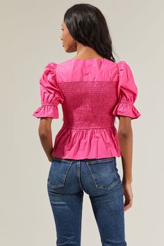 When it comes to visuals, the Chelsa Peplum Smocked Top knows how to come out on top! It shapes a front tie, a smocked bodice, and puff half short sleeves with elastic and ruffles. Set-in waist tops the flouncy peplum hem. It’s a unique top to match with some denim jeans and pink heels or sandals! - Smocked- Peplum- Puff sleeves- Breathable- Comes in 2 colorsSize + Fit - Model is 5'8" and wearing size XS- Measurements taken from size S - Chest: 13 1/2"- Length: 22" Fabric STT16759 Style Number S Spring Top With Smocked Back And Puff Sleeves, Spring Top With Gathered Sleeves For Daywear, Puff Sleeve Tops With Smocked Cuffs For Daywear, Daywear Tops With Smocked Cuffs And Puff Sleeves, Fitted Tops With Smocked Back For Spring, Spring Stretch Smocked Top With Short Sleeves, Spring Short Sleeve Smocked Stretch Top, Spring Puff Sleeve Tops With Smocked Cuffs, Stretch Smocked Top With Short Sleeves For Spring