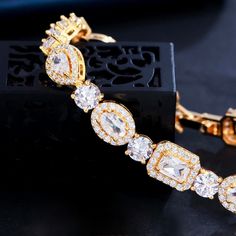 A beautiful piece of remarkable elegance, this exquisite bracelet will add a touch of sophistication to any wedding gown or formal ensemble. Adorned with flawlessly faceted cubic zirconia that captures the light from every angle with a perfectly translucent appeal, the bracelet is rhodium / rose gold / yellow gold plated for a flawless finish which perfectly enhances the intricate detailing and conveys a modern take on old elegance. Length: 7" (approx. 17.8cm); Width: 0.3" (approx. 0.8cm). Closu Bridal Accessories Belt, Hair Accessories Tiara, Flower Girl Jewelry, Geometry Shape, White Bracelet, Pearl Bridal Jewelry, Cubic Zirconia Bracelet, Rose Gold Bridal, Pearl Jewelry Sets