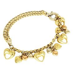 Vintage Kingdom of Hearts 18k Gold Bracelet. The bracelet is beautiful and noticeable in public. The bracelet is 7.5 inches in length and is 6.5mm wide. The bracelet is made of 18k gold and features yellow gold, white gold and rose gold hearts. The bracelet weights 16.8 grams. Kingdom Of Hearts, Heart Padlocks, Gold Link Bracelet, Vintage Charm Bracelet, Modern Bracelets, 18k Gold Bracelet, French Jewelry, Gold Hearts, Gold Armband