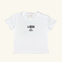 Elevate your summer wardrobe with our special collection of minimal and stylish Signs Baby Tees. This white tee, featuring the Libra, offers a perfect blend of comfort and style, making it an essential piece for everyday outfits. It's minimal design and basic fit ensure it pairs effortlessly with any look. This unique collection celebrates the signs, making it a thoughtful gift or a personal treat. Don't miss out on the other designs in this collection! Visit our shop, Minel, to explore all the collections and find your perfect match. Material: 80% Cotton 20% Lycra Unisex Organic Cotton T-shirt For Summer, Basic Summer T-shirt, Basic Short Sleeve T-shirt For Summer, White Print T-shirt For Summer, White Cropped T-shirt With Text Print, Relaxed Fit, White Relaxed Fit Cropped T-shirt With Text Print, Minimalist Crew Neck T-shirt For Summer, Unisex Logo Print T-shirt For Summer, Unisex Summer T-shirt With Logo Print