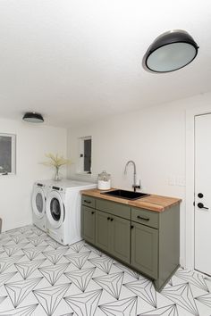 a washer and dryer in a small room