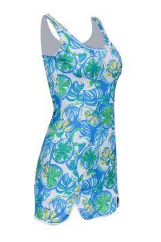 Keep your style fresh, fun, and floral for the summer with this brightly printed Lilly Pulitzer dress! This piece is designed with a bodycon silhouette and mini cut to create a spunky feel that matches the vibrant print featuring flowers and fruit. Slip into this cheery little mini for some fun in the sun along with sandals and your favorite pair of sunnies! Size XXS 100% Polyester Fully lined Pullover Bodycon silhouette Scoop neckline Sleeveless Bust 30" Waist 24" Shoulder to hem 31" Summer Patterned Mini Dress, Blue Sleeveless Stretch Swim Dress, Blue Stretchy Sleeveless Swim Dress, Blue Swimwear With Vibrant Print For Spring, Spring Blue Swimwear With Vibrant Print, Fitted Summer Mini Dress For Poolside, Summer Bodycon Printed Mini Dress, Vibrant Print Patterned Mini Dress For Summer, Blue Printed Mini Dress For Summer