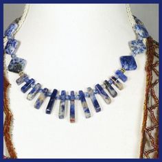 "Handmade, One of a Kind, Gemstone and Sterling Silver (silver filled), Cleopatra Collar/Fan style Necklace. Very good quality Sodalite Gemstones in 3 different shapes:  Graduated Fan Beads, Square Beads set on Diamond and small round beads.  These are spaced with decorative sterling silver beads and the necklace is finished with a sterling silver toggle clasp and findings. The Sodalite stones are a blend of deep lapis blue through to soft grey tones with a touch of red earth. Measurements:  *Ne Handmade Sapphire Kyanite Necklace, Handmade Sapphire Necklace In Kyanite, Handmade Sodalite Round Bead Necklaces, Handmade Sodalite Round Beads Necklace, Handmade Kyanite Healing Necklaces, Handmade Blue Sodalite Necklaces, Sodalite Gemstone For Jewelry Making, Handmade Bohemian Kyanite Jewelry, Bohemian Beaded Sodalite Jewelry