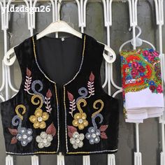 ❤️ Beautiful black vest with HANDMADE embroidery beaded flowers. This piece is truly a work of art! Our handmade vests are beautiful, stylish works of art combined with beads and sequins. The beads are charmingly arranged in colors that match perfectly with the carefully selected fabric. They are modern crop top style vests with a twist of indigenous and traditional textile from Mardin.  You can use it comfortably in your daily life or on special occasions. 💫 "Wearing it feels like getting a hu Black Folk Style Festival Vest, Black Floral Embroidery Sleeveless Vest, Bohemian Black Embroidered Vest, Traditional Black Vest For Festival, Folk Style Festive Vest With Floral Embroidery, Festive Folk Vest With Floral Embroidery, Stylish Words, Crop Top Styles, Womens Black Vest