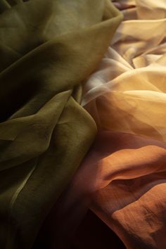 Ochre {Gossamer Silk Fabric} Hand-loomed, 100% organic silk fabric. This material has a unique body and texture. The light airiness of our gossamer silk creates a transparent veil of color when used for flatlay photography or vignette styling. Create a sculptural look when tucked and pinned. Creates a show-stopping look when draped on a table, or hanging as a backdrop. Planning a large event? Contact us for larger quantities here. Ochre Gossamer Silk Fabric has many uses! • Use as a transparent Draped Fabric Backdrop, Draped Fabric Photography, Textile Aesthetic, Silk Fabric Texture, Narnia Oc, Transparent Veil, Vignette Styling, Flatlay Photography, Fabric Draping