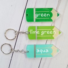 "Personalized Teacher Name Acrylic Colored Pencil Key chain with Tassel, Great Pre School Teacher Appreciation Gift. Great Teacher Appreciation gift for your child's favorite teacher's keys! Chose tassel from drop down box. This listing is for ONE (1) Personalized key chain with your child's or teacher's name - great backpack or lunchbox tag, a super cute gift. Acrylic keychain measures 3\", plus approx 2\" of keychain. Design is custom cut vinyl, personalization will be black vinyl. Leave teach Personalized Green Craft Supplies For Gift, Green Rectangular Craft Supplies For School, Green School Craft Supplies With Pen Holders, Customizable Educational Craft Supplies For Gifts, Cute Stationery For End Of School Year Gift, Blue Pencil-shaped Craft Supplies For Gifts, Personalized Pencil Craft Supplies For Gifts, Cute Green Keychains For Gifts, Personalized Educational Stationery For Gifts