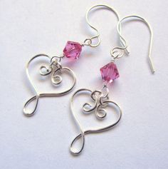 Celtic Heart Earrings - Silver Wire wrapped and Choice of Crystal - Valentine's Day Dangle Earrings - Elven Heart Swirl. $14.00, via Etsy. Handmade Heart Earrings For Wedding On Valentine's Day, Spiral Sterling Silver Earrings For Gift, Spiral Sterling Silver Earrings As Gift, Handmade Silver Heart Earrings For Valentine's Day, Sterling Silver Heart Drop Earrings For Valentine's Day, Sterling Silver Valentine's Day Heart Drop Earrings, Pink Sterling Silver Heart Earrings For Mother's Day, Valentine's Day Sterling Silver Drop Earrings, Valentine's Day Adjustable Wire Wrapped Jewelry