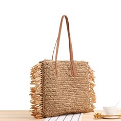 Elena Handbags Large Straw Woven Tote Bag with Tassels and Leather Strap Size: 40cm wide x 38cm tall. (16in x 15in) Designer Style ID: 8220 Large Straw Woven Tote Bag, Summer Bag, Everyday Shoulder Bag, Beach Bag Luxury Beige Jute Beach Bag, Chic Travel Bag With Fringe, Chic Travel Hobo Bag With Fringe, Chic Travel Bucket Bag With Fringe, Chic Fringe Hobo Bag For Travel, Square Shoulder Bag For Beach Season, Square Shoulder Bag For Beach Season Shopping, Bohemian Style Bags For Beach Season Shopping, Bohemian Beach Bags For Shopping