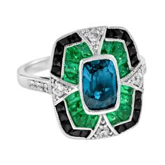 For Sale on 1stDibs - A striking and intriguing jewel, indeed. This bold and colorful Art Deco style ring highlights a gorgeous gleaming emerald cut London blue topaz framed Luxury Emerald Gemstones With Accent Stones, Luxury Emerald-cut Sapphire Ring With Gemstone Accents, Luxury Sapphire Ring With Emerald Cut And Gemstone Accents, Luxury Emerald Cut Sapphire Ring With Gemstone Accents, Elegant Octagon Multi-stone Ring, Emerald Cut Multi-stone Emerald Jewelry, Luxury Emerald-cut Sapphire Ring With 17 Jewels, Art Deco Sapphire Baguette Cut Ring, Art Deco Sapphire Ring With Baguette Cut