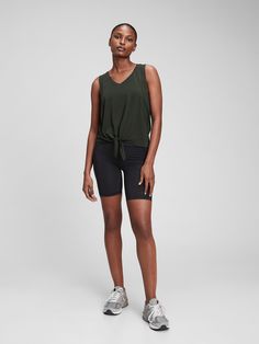 Breathable, lightweight performance jersey knit keeps you cool during your workout.  Moisture wicking helps keep your skin dry.  Four-way stretch allows freedom of movement while providing superior shape retention.  Tank straps.  V-neck.  Knot-front detail. V-neck Summer Activewear For Workout, Casual V-neck Activewear For Yoga, Gap Casual Stretch Activewear, Functional V-neck Activewear For Yoga, V-neck Athleisure Activewear For Workout, Functional V-neck Yoga Activewear, Casual Gap Activewear For Workout, Summer Sports V-neck Activewear, Summer V-neck Activewear For Sports