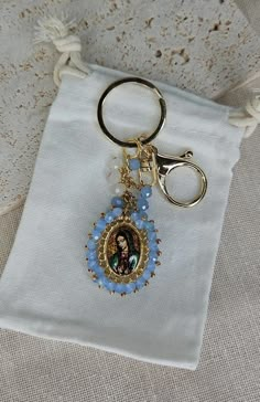 Discover the most divine pendant for your keys. A charm with a heavenly touch that will accompany you on every adventure. Our Virgin Mary and Jesus key pendant is the perfect gift for your Baptism, Quinceanera, Wedding, First Communion event who wish to carry with them divine protection. The handmade Blessings of the Virgin Mary are Double-sided, made with crystals glass beads are embroidered with a total of 130 crystal rondel beads and glass beads, wire and ribbon, these Blessings are an impressive accessory for him for your keys, they are a great gift, for any occasion, Christening, graduation, birthday, also You can use it as a decoration in the office, bedroom, Our Blessings remind us of spirituality, Faith, Hope, Love This Catholic religious charm is one of a kind and will fill you wi Spiritual Wedding Miraculous Medal Jewelry, Diy Catholic Gifts, Spiritual Jewelry With Miraculous Medal As Gift, Miraculous Medal Pendant For Wedding, Wedding Miraculous Medal Pendant, Catholic Gifts For Women, September Vibes, The Virgin Of Guadalupe, Rosary Making