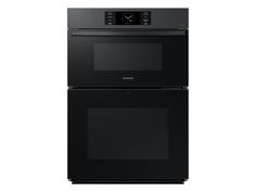 two black ovens side by side against a white background