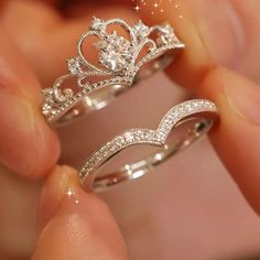 two wedding rings that have been made to look like princess crowns