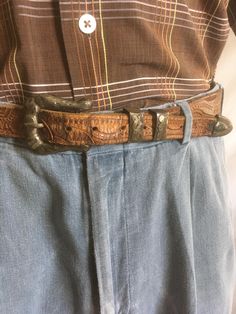 vintage 1940s belt brown tooled leather sterling silver Mexico stamped engraved buckle set- matching buckle, 2 keepers, and tip good vintage condition, w/age wear silver has a beautiful age tarnished patina still functional fits waist sizes 32" to 40" belt measures, approximately 42" x 1 1/4"  buckle measures, approximately 2" x 1 1 7/8" belt has snaps allowing for buckle and keepers removal Vintage Engraved Leather Belt, Vintage Hand Tooled Leather Belt Buckles, Vintage Engraved Belt Buckles For Rodeo, Rustic Distressed Brown Belt Buckle With Antique Design, Vintage Brown Hand-tooled Belt Buckle, Engraved Brown Belt Buckles For Western-themed Events, Vintage Brown Engraved Belt Buckles, Vintage Engraved Brown Belt Buckles, Vintage Distressed Brown Belt Buckles