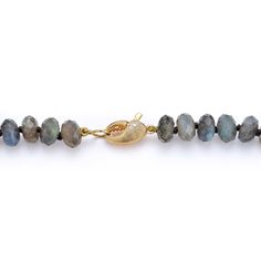 Faceted labradorite culminates with a cheeky crab claw clasp. Labradorite is a stone of transformation. Associated with the throat chakra, it can connect a person with the divine and help discover their true self. Also known as a protector stone, labradorite is believed to shield against misfortunes. Made to order. Healing Natural Labradorite Gemstones, Spiritual Labradorite Jewelry With Gemstone Beads, Hand-strung Labradorite Gold Jewelry, Labradorite Gemstone Beads Necklace For Meditation, Faceted Labradorite Round Beads Jewelry, Oval Labradorite Necklace With Natural Stones, Spiritual Labradorite Gemstone Necklace, Adjustable Labradorite Gemstone Beaded Necklaces, Artisan Oval Labradorite Necklace