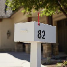 a white mailbox with the number 82 on it