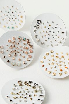 Set of 40 small delicate studs including 13 sets with shimmering stones and 7 sets with fun metal shapes. Easily mix and match to create your unique look. | Teeny Tiny Mega Stud Earring Set by Free People in Gold Colorful Stud Earrings, Small Earrings Gold, Polymer Clay Flower Jewelry, Cute Stud Earrings, Magnetic Earrings, Buy Earrings, Tiny Studs, Tiny Earrings, Tiny Stud Earrings