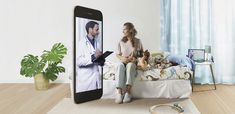 a woman sitting on a bed next to a cell phone with an image of a doctor on the screen