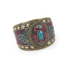 Vintage, Tibetan Cuff Bracelet, Blue Red Chip, Gold Tone. Size - Please see picture.  Condition - There is a chip in the large blue stone. Some tarnish / wear. Good vintage condition. FREE SHIPPING TO USA - on orders of $35.00usd ($48.00cad) or more (No coupon code needed) FREE SHIPPING TO CANADA - on orders of $92.00usd ($125.00cad) or more (Please use coupon code FREESHIP125) FREE SHIPPING INTERNATIONAL - on orders of $146.00usd ($200.00cad) or more (Please use coupon code FREESHIP200) Red Bohemian Cuff Bracelet As Gift, Bohemian Red Cuff Bracelet As Gift, Bohemian Style Red Cuff Bracelet As Gift, Bohemian Multicolor Gemstone Cuff Bracelet, Red Metal Cuff Bracelet Bangle, Red Metal Bangle Cuff Bracelet, Red Jeweled Bangle As A Gift, Red Jeweled Bangle For Gift, Red Metal Bohemian Bangle