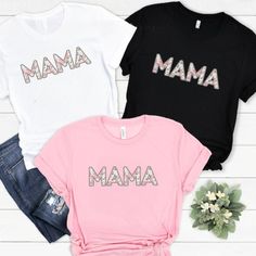 Personalised  Floral Mama T-shirt, Mama Tshirt, Bespoke Mothers Day, New Mum Shirt, First Mothers Day Tee, Mom top. Personalized gift. This listing is for a high quality bespoke Mum T-shirt that is a hand made item, made to order. Our Mama tshirt is handmade with the finest machinery ensuring the ultimate quality for you. Using only premium  tees, your handmade T Shirt will be SUPER soft and SUPER comfy Material: Luxuriously 100% Cotton, Breathable, and super Soft Material Handmade Quality: Crafted with the finest machinery for unmatched quality. Design Options: Choose between printed or blank styles. How to Order ❤️ Select the colour and size of Tshirt you require ❤️ Select Printed or Unprinted / Blank Sizing Guide These T Shirts are a Unisex size so we recommend that you measure and comp Letter Print Tops For Mother's Day, Mother's Day Gift Tops With Letter Print, Graphic Tee With Letter Print As Gift, Trendy Text Print Top As Gift, Letter Print Crew Neck Tops For Gifts, Mother's Day Letter Print Tops Gift, Trendy Screen Print Tops For Mother's Day, Short Sleeve Tops With Letter Print For Mother's Day, Mother's Day Letter Print Short Sleeve Tops