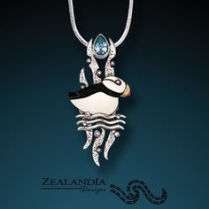 Welcome to the Zealandia Designs jewelry collection! This intricate pendant from our puffin jewelry collection marries rich, natural materials and our designers' signature layered approach to fine jewelry making, creating a one-of-a-kind piece. Item Details: - Hand carved and inked Indonesian cow bone - 14kt gold fill beak detail - Faceted teardrop cut blue topaz accent - Textured sterling silver setting - Chain purchased separately The generous bale on the back will accommodate most chains, or Cow Bones, Iridescent Green, Blue Topaz Pendant, Bird Necklace, Bird Earrings, Silver Snake Chain, Bird Jewelry, Green Gifts, Snake Chain