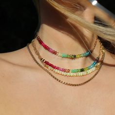 This brilliant and colorful choker is made of precious and rare natural gemstones, arranged to form a rainbow: Tanzanite, Blue Apatite, Topaz, Aquamarine, Peridot, Green Tourmaline, Tsavorite, Chrysoprase, Pink Tourmaline, Pink Sapphire, Ruby, Red Spinel, and Garnet.  This rainbow necklace features gemstones known for their healing properties. They promote vitality, creativity, and emotional healing, balance energy, clear blockages, boost confidence, and foster inner peace. A symbol of harmony, Colorful Chain Necklace, Colorful Choker, Rainbow Choker, Pride Jewelry, Balance Energy, Pride Jewellery, Red Spinel, Fruit Jewelry, Peridot Green