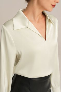 Experience the epitome of elegance with our Satin Blouse. Combining a loose fit with a smooth and comfortable fabric, this blouse is designed to make you feel effortlessly stylish. With long sleeves, a flattering V-neck, and a lapel collar, this piece exudes timeless charm. Material : 95%Polyester+5%Elastane.Elasticity : Low Stretchy.Sku : CL2156A23Package : 1*TopsCare instructions: Max wash temp: 30℃, No bleach, No tumble dry, Iron max 110℃, Wash dark colors separately, No PU ironing. Elegant V-neck Blouse For Office, Chic Solid Color V-neck Shirt, Classic Collared Viscose Top, Elegant Fall Top With Collared Neckline, Elegant Collared Top For Fall, Elegant Fall Tops With Collared Neckline, Long Sleeve Viscose Tops For Work, Viscose Long Sleeve Workwear Tops, Viscose Long Sleeve Tops For Work