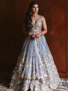 Introducing the Gorgeous Sky Blue Zari Work Net Wedding Wear Lehenga Choli - a stunning addition to your ethnic wear collection that is sure to make heads turn! Perfect for weddings, bridesmaids, receptions, and ceremonies.
Crafted in India from high-quality net fabric, this semi-stitched lehenga choli can be customized to fit up to 42 inches. The lehenga itself is designed with sky blue zari work and paper foil work, as well as a cancan attachment that adds volume to the skirt. The sky blue zar Bollywood Lengha, Sky Blue Lehenga, Orang India, Lehenga Choli Designs, Mirror Work Lehenga, Bridesmaid Lehenga, Choli For Women, Sabyasachi Lehenga, Indian Lehenga Choli