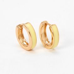 Give your ears a trendy hug with this pair of huggie hoop earrings. These hoops feature a classic huggie hoop style in gold-tone with a yellow enamel accent. Finish: Gold-tone Diameter: 15MM Closure: Hinge snap Material: Metal - Claire's Gold 15MM Yellow Enamel Huggie Hoop Earrings Cute Gold Hoop Earrings, Claires Earrings, Trio Halloween Costumes, Golden Hoops, Cheap Earrings, Yellow Jewelry, Gold Jewelry Earrings, Fashionable Jewelry, Yellow Earrings