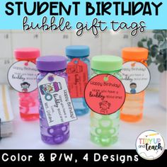 the student birthday bubble gift tags are on display in front of some bottles with labels