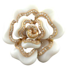 A sweet and fun cocktail ring made of carved white onyx and diamonds. The diamonds weigh 0.58 carats and are set around the pedals of the Camellia. The pedals themselves are made of 34.40 carats of white onyx which has been hand carved and polished to form a very realistic Camellia. Made in 18k rose gold, this lovely piece is ready to be worn. Ring Size 6.50 Weight: 18.4 grams Luxury White Flower Shaped Ring, Luxury White Flower-shaped Ring, 3d Printed Jewelry, White Onyx, Camellia Flower, Printed Jewelry, Fun Cocktails, Cocktail Ring, Cocktail Rings