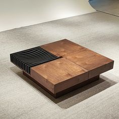 a wooden table sitting on top of a carpeted floor