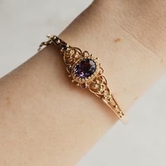 This is a perfect piece of fine jewelry history. A 14K yellow gold filigree bracelet with an oval 3.93ct amethyst secured by a stunning multi-prong setting. This bracelet has a fully functional hinge clasp and safety chain. The bracelet is in beautiful shape. Heirloom Gemstone Bracelet Jewelry, Heirloom Gemstone Bracelet, Ornate Gemstone Bangle Jewelry, Oval Purple Jewelry With Intricate Design, Wedding Jewelry With Filigree Amethyst, Heirloom Oval Bracelets For Formal Occasions, Formal Amethyst Jewelry With Intricate Design, Purple Filigree Jewelry For Formal Occasions, Purple Oval Filigree Jewelry