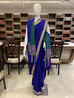 A Marvellous Embroidered Kashmiri Saree, which you can wear at any party or a wedding.- - - - - - - - - - - - - - - - - - - - Product Details- Condition: Brand New- Style: Saree- Embroidery: Kashmiri Tilla Embroidery- Base Colour: Royal Blue- Embroidery Colour: Golden - Care Instructions: Dry Clean OnlyF A B R I CSaree: Pure CrepeBlouse: Pure CrepeF I N I S H- UnstitchedYou can get it stitched locally.- StitchedWant your blouse ready to wear, let us know the style you want and we will stitch it Semi-stitched Traditional Wear For Celebration, Blue Jamawar Wedding Dress, Embroidered Raw Silk Dresses For Traditional Ceremonies, Traditional Blue Blouse Piece For Party, Traditional Blue Blouse For Party, Blue Jamawar Dress For Eid, Blue Traditional Party Blouse Piece, Traditional Blue Party Blouse Piece, Festive Dress With Embroidered Border And Traditional Drape