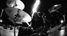 black and white photograph of drums on stage