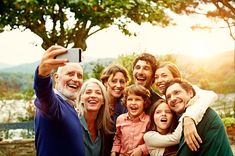 a family taking a selfie with their cell phone