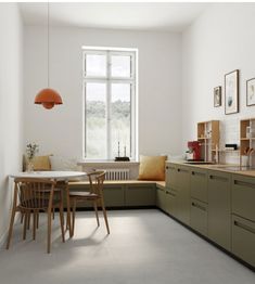 the kitchen is clean and ready to be used for dinner or lunchtime, as well as dining room furniture